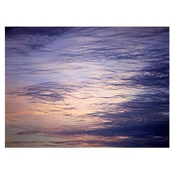  - Thin black gray whispy cloud on blue yellow sky Orkney  photo 