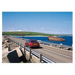3rd Churchill Barrier - Car driving on causeway road wartime block ship  photo 