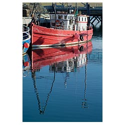 Stromness Harbour - Red hulled converted trawler diving boat at quayside dive reflect  photo 