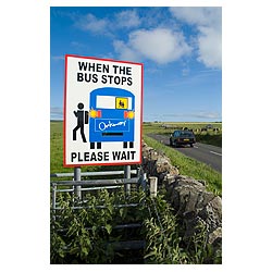 Bus stop - Safety school traffic warning sign displayed at side main road with car  photo 