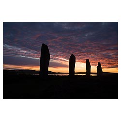 Neolithic standing stones - Orange pink and grey sunset cloudy dusk sky world heritage site bronze age  photo
 