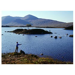 Lochan na h Achlaise - Angler casting fishing line freshwater lake mountainous wetland terrain uk  photo
 