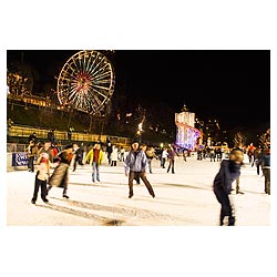 Princes Street Gardens - Skaters on ice Winter wonderland ice rink and funfair New Year time outdoor  photo
 