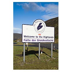 Welcome to the Highlands sign - Signpost in English and Gaelic scotland road signs language  photo
 