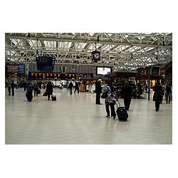  - Passengers arriving with suitcases at train timetable board railway travel  photo 