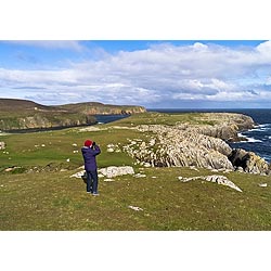 Bu Ness sea cliffs - Scotland Birdwatcher binoculars watching birds watcher bird twitching people  photo 