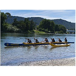 maori new zealand people girls paddling waka canoe  photo stock