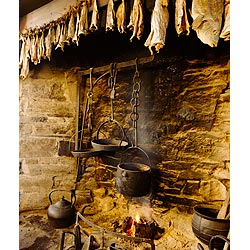 Farm museum - Farmhouse fireplace kettle pots and dried fish drying hearth open fire  photo 
