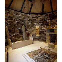 Replica - Box bed and fireplace inside replica of prehistoric house neolithic hearth  photo 