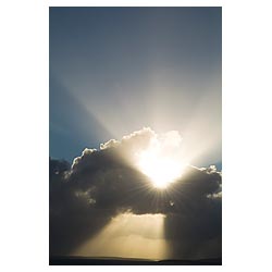  - Black grey storm clouds with ray of sunlight from white sun sky moody cloud  photo 