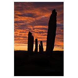  - Neolithic standing stones orange pink and grey sunset cloudy dusk sky uk  photo 