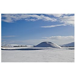 Neolithic burial tomb - Chamber mound snowscape bronze age Britain world heritage site snow winter  photo 