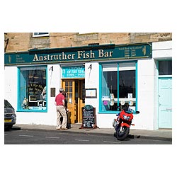 Anstruther Fish Bar - Scottish tourists Couple entering famous Fish and Chip shop Scotland  photo 